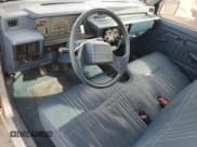 ✅ 1988 Mitsubishi Mighty Max • VIN: JA7FL24D2JP013297 • Lot: 79533724. Wystawiony na Copart z przebiegiem 117 397 mil. Bezpłatny archiwum sprzedaży aukcyjnych z USA i szczegółowy raport historii pojazdu na DreamBid. Zdjęcie 8.