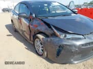 ✅ 2021 Toyota Prius L Eco • VIN: JTDKAMFU2M3147335 • Lot: 42652103. Listed on IAAI with 122,658 mi. Free auction sales archive from the USA and detailed vehicle history report at DreamBid. Image 6.