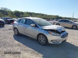 ✅ 2017 Ford Focus Titanium • VIN: 1FADP3J21HL279912 • Лот: 43351297. Опубликован ранее на IAAI с пробегом 128 794 миль. Бесплатный доступ к архиву аукционных продаж из США и подробный отчёт об истории автомобиля на DreamBid. Изображение 1.