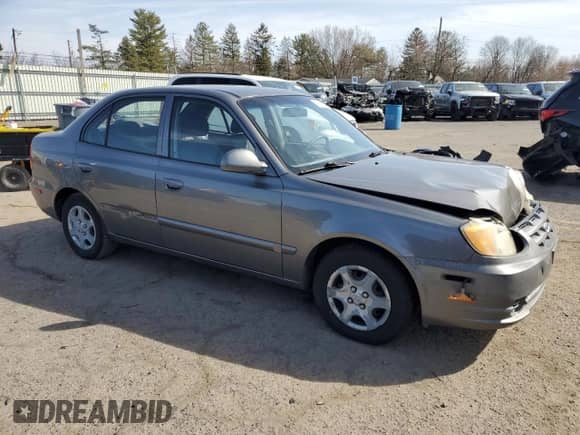 2005 Hyundai Accent GLS z VIN KMHCG45C65U625887, wystawiony jako Copart lot #48824225 z przebiegiem 110 594 mil mil oraz Szkoda całkowita • Salvage title. Historia ofert i sprzedaży dostępna na DreamBid. Obrazek 4.
