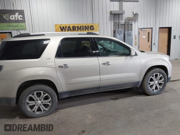 ✅ 2015 GMC Acadia SLT • VIN: 1GKKVSKD1FJ301342 • Lot: 43566026. Listed on IAAI with 103,023 mi. Free auction sales archive from the USA and detailed vehicle history report at DreamBid. Image 13.