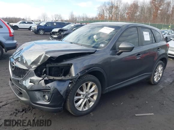 ✅ 2014 Mazda CX-5 Grand Touring • VIN: JM3KE4DY6E0348241 • Lot: 43764952. Wystawiony na IAAI z przebiegiem 149 149 mil. Bezpłatny archiwum sprzedaży aukcyjnych z USA i szczegółowy raport historii pojazdu na DreamBid. Zdjęcie 2.