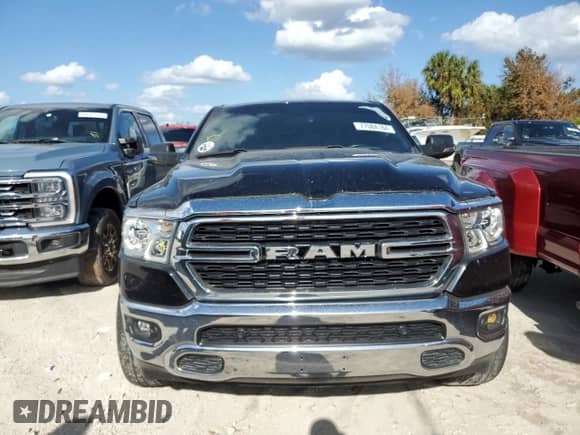2023 Ram 1500 Lone Star with VIN 1C6RREMT8PN565793, listed as a Copart auction lot 77084184 with 18,825 mi miles and Salvage title. Bid and sale history available at DreamBid. Image 5.