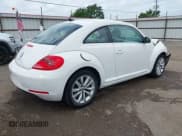 ✅ 2014 Volkswagen Beetle 2.0L TDI w/Sun/Sound/Nav • VIN: 3VWJL7AT1EM621584 • Лот: 42340715. Опубликован ранее на IAAI с пробегом 92 443 миль. Бесплатный доступ к архиву аукционных продаж из США и подробный отчёт об истории автомобиля на DreamBid. Изображение 4.