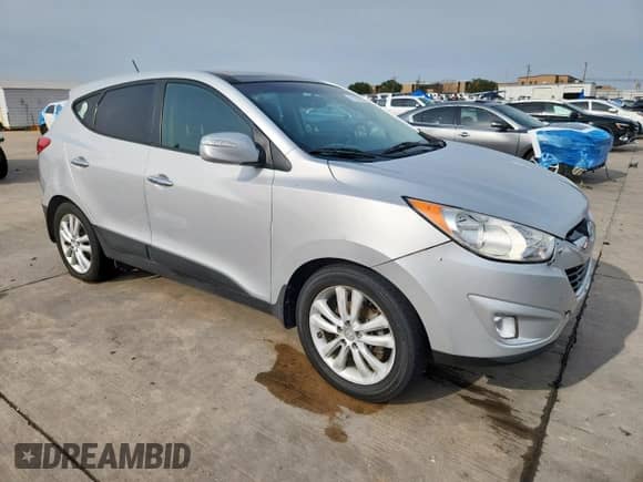 2013 Hyundai Tucson GLS with VIN KM8JU3AC7DU566198, listed as a Copart auction lot 71479605 with 196,474 mi miles and Salvage title. Bid and sale history available at DreamBid. Image 4.