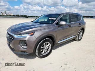 ✅ 2019 Hyundai Santa Fe SE • VIN: 5NMS23AD6KH088691 • Лот: 86144505. Опубликован ранее на Copart с пробегом 207 477 миль. Бесплатный доступ к архиву аукционных продаж из США и подробный отчёт об истории автомобиля на DreamBid. Изображение 1.