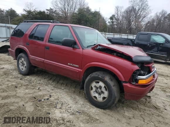 2003 Chevrolet Blazer LS z VIN 1GNDT13X43K143038, wystawiony jako Copart lot #81224304 z przebiegiem 245 877 mil mil oraz Nie do naprawy • Non repairable. Historia ofert i sprzedaży dostępna na DreamBid. Obrazek 4.