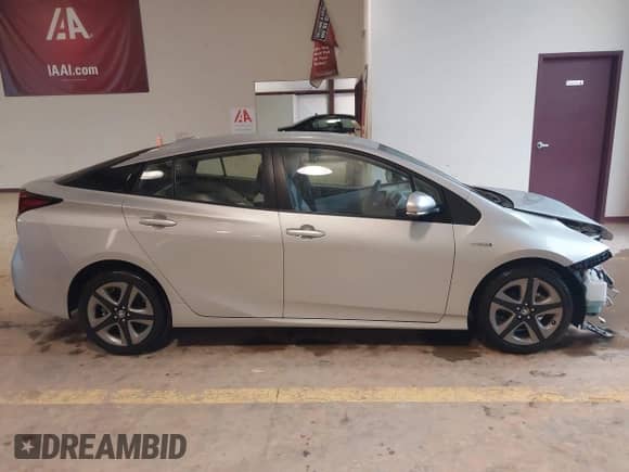 2021 Toyota Prius L Eco with VIN JTDKAMFU4M3147210, listed as a IAAI auction lot 42437023 with 12,673 mi miles and . Bid and sale history available at DreamBid. Image 13.