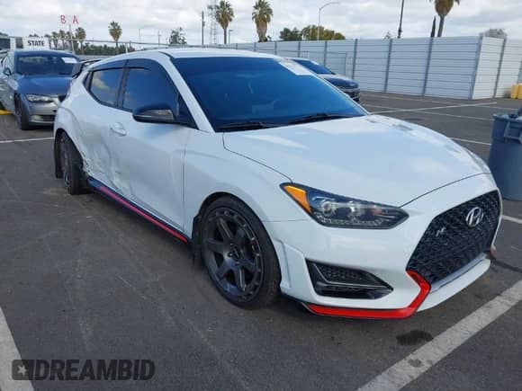 2019 Hyundai Veloster N z VIN KMHT36AH6KU001916, wystawiony jako IAAI lot #41577775 z przebiegiem 77 471 mil mil oraz . Historia ofert i sprzedaży dostępna na DreamBid. Obrazek 1.