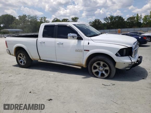 ✅ 2015 Ram 1500 Laramie • VIN: 1C6RR7JMXFS631477 • Lot: 66946105. Listed on Copart with 152,007 mi. Free auction sales archive from the USA and detailed vehicle history report at DreamBid. Image 4.