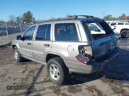 ✅ 1999 Jeep Grand Cherokee Laredo • VIN: 1J4GW58S1XC520727 • Lot: 43730318. Wystawiony na IAAI z przebiegiem 154 356 mil. Bezpłatny archiwum sprzedaży aukcyjnych z USA i szczegółowy raport historii pojazdu na DreamBid. Zdjęcie 3.