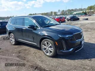 ✅ 2023 Cadillac XT6 AWD Premium Luxury • VIN: 1GYKPDRS8PZ153838 • Лот: 41838527. Опубликован ранее на IAAI с пробегом 60 034 миль. Бесплатный доступ к архиву аукционных продаж из США и подробный отчёт об истории автомобиля на DreamBid. Изображение 1.