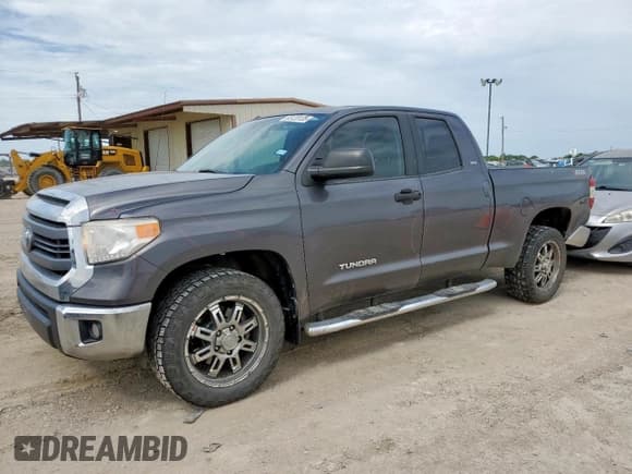 ✅ 2015 Toyota Tundra SR • VIN: 5TFRM5F15FX094689 • Lot: 65120135. Listed on Copart with 115,542 mi. Free auction sales archive from the USA and detailed vehicle history report at DreamBid. Image 1.