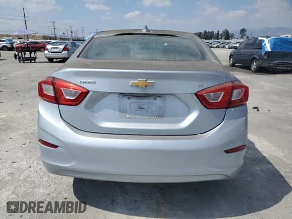 ✅ 2018 Chevrolet Cruze LT • VIN: 1G1BE5SM2J7114834 • Lot: 80557205. Listed on Copart with 131,256 mi. Free auction sales archive from the USA and detailed vehicle history report at DreamBid. Image 6.