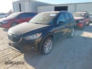✅ 2014 Mazda CX-5 Grand Touring • VIN: JM3KE2DY7E0345255 • Lot: 43668720. Listed on IAAI with 270,412 mi. Free auction sales archive from the USA and detailed vehicle history report at DreamBid. Image 2.