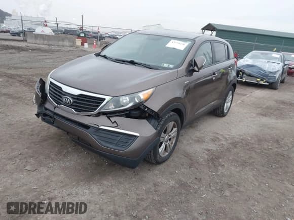 ✅ 2013 Kia Sportage LX • VIN: KNDPBCA2XD7499560 • Lot: 43779256. Listed on IAAI with 124,583 mi. Free auction sales archive from the USA and detailed vehicle history report at DreamBid. Image 2.