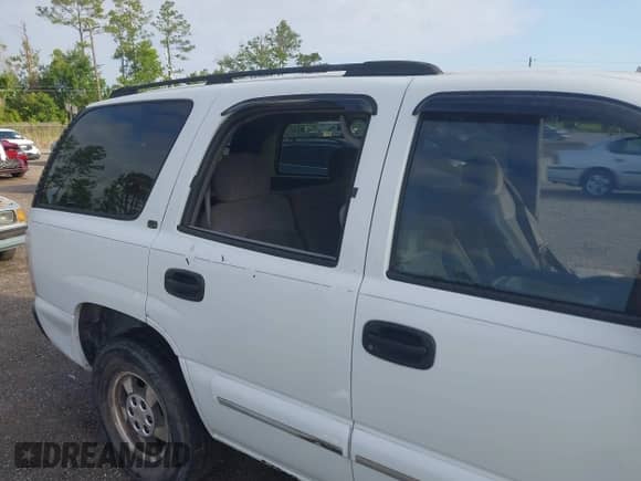 2001 Chevrolet Tahoe LT z VIN 1GNEK13T41J124223, wystawiony jako IAAI lot #42606239 z przebiegiem Nie podano mil oraz . Historia ofert i sprzedaży dostępna na DreamBid. Obrazek 6.