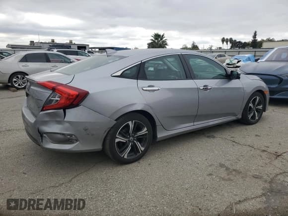 ✅ 2017 Honda Civic Touring • VIN: 2HGFC1F98HH638809 • Lot: 87279695. Listed on Copart with 301,661 mi. Free auction sales archive from the USA and detailed vehicle history report at DreamBid. Image 3.