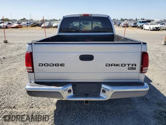 2004 Dodge Dakota SLT with VIN 1D7HL48K44S780575, listed as a Copart auction lot 57872335 with 148,785 mi miles and Salvage title. Bid and sale history available at DreamBid. Image 6.