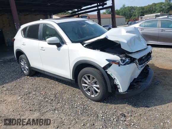 ✅ 2023 Mazda CX-5 S Carbon Edition • VIN: JM3KFBCM3P0271198 • Lot: 43280639. Listed on IAAI with 9,481 mi. Free auction sales archive from the USA and detailed vehicle history report at DreamBid. Image 1.
