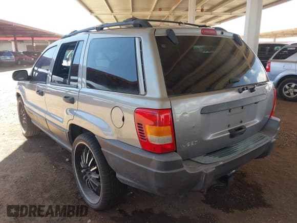 ✅ 2001 Jeep Grand Cherokee Laredo • VIN: 1J4GX48S21C648442 • Lot: 42023940. Listed on IAAI with 202,630 mi. Free auction sales archive from the USA and detailed vehicle history report at DreamBid. Image 3.