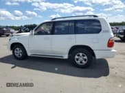 ✅ 2002 Toyota Land Cruiser • VIN: JTEHT05J022028895 • Lot: 70348635. Listed on Copart with 154,453 mi. Free auction sales archive from the USA and detailed vehicle history report at DreamBid. Image 2.