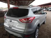 ✅ 2013 Ford Escape Titanium • VIN: 1FMCU0J92DUB64035 • Lot: 42023748. Listed on IAAI with 177,636 mi. Free auction sales archive from the USA and detailed vehicle history report at DreamBid. Image 4.