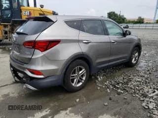 ✅ 2018 Hyundai Santa Fe 2.4L • VIN: 5NMZTDLB8JH073198 • Лот: 57329813. Опубликован ранее на Copart с пробегом 72 018 миль. Бесплатный доступ к архиву аукционных продаж из США и подробный отчёт об истории автомобиля на DreamBid. Изображение 3.
