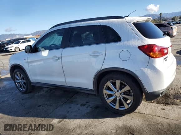 2013 Mitsubishi Outlander LE with VIN 4A4AP5AU0DE022676, listed as a Copart auction lot 86818835 with 221,484 mi miles and Salvage title. Bid and sale history available at DreamBid. Image 2.