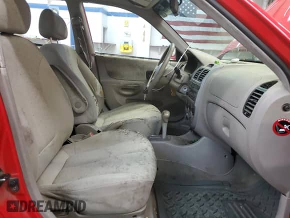 2005 Hyundai Accent GLS with VIN KMHCG45C05U661607, listed as a Copart auction lot 71812814 with 238,630 mi miles and Salvage title. Bid and sale history available at DreamBid. Image 7.