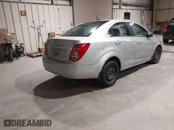 ✅ 2013 Chevrolet Sonic LS • VIN: 1G1JA5SH1D4150613 • Lot: 43875285. Listed on IAAI with 91,141 mi. Free auction sales archive from the USA and detailed vehicle history report at DreamBid. Image 4.