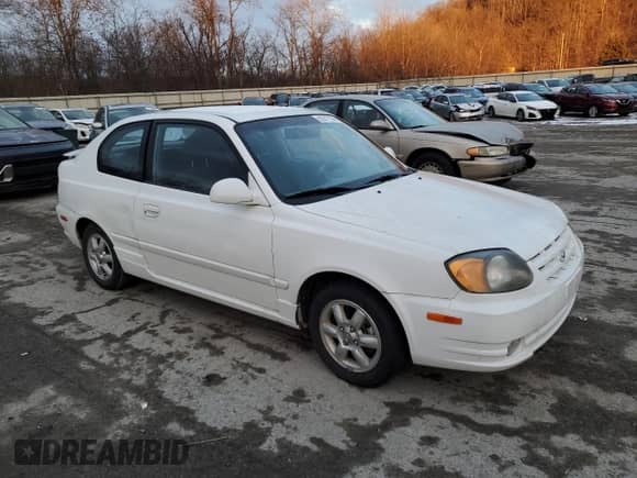2003 Hyundai Accent GL with VIN KMHCG35C53U258469, listed as a Copart auction lot 82977294 with 99,136 mi miles and Clean title. Bid and sale history available at DreamBid. Image 4.