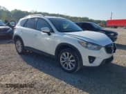 ✅ 2015 Mazda CX-5 Grand Touring • VIN: JM3KE4DY0F0471311 • Lot: 43302501. Listed on IAAI with 80,245 mi. Free auction sales archive from the USA and detailed vehicle history report at DreamBid. Image 1.