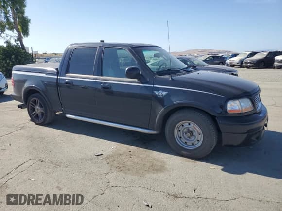 ✅ 2003 Ford F-150 Harley-Davidson • VIN: 1FTRW07373KC44985 • Lot: 58571585. Listed on Copart with 202,249 mi. Free auction sales archive from the USA and detailed vehicle history report at DreamBid. Image 4.