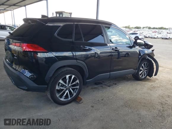 ✅ 2023 Toyota Corolla Cross XLE • VIN: 7MUDAABG6PV048792 • Lot: 56819095. Listed on Copart with 59,189 mi. Free auction sales archive from the USA and detailed vehicle history report at DreamBid. Image 3.