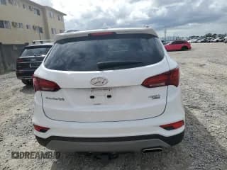 ✅ 2018 Hyundai Santa Fe 2.4L • VIN: 5NMZUDLB4JH104458 • Лот: 70008413. Опубликован ранее на Copart с пробегом 56 961 миль. Бесплатный доступ к архиву аукционных продаж из США и подробный отчёт об истории автомобиля на DreamBid. Изображение 6.