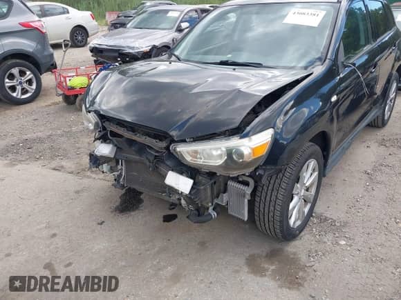 2014 Mitsubishi Outlander ES with VIN 4A4AR3AU7EE002506, listed as a IAAI auction lot 43083381 with 87,329 mi miles and . Bid and sale history available at DreamBid. Image 6.