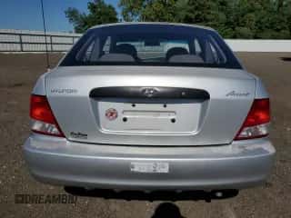 2002 Hyundai Accent с VIN KMHCF35G72U217653, выставлен на аукционе Copart как лот 70099915 с пробегом 168 308 миль миль и Списание • Salvage title. История ставок и продаж доступна на DreamBid. Изображение 6.