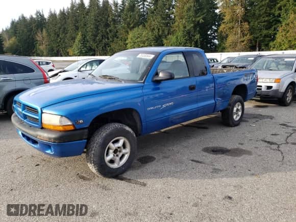 1998 Dodge Dakota SLT with VIN 1B7GG22XXWS598594, listed as a Copart auction lot 75330344 with 167,518 mi miles and Clean title. Bid and sale history available at DreamBid. Image 1.