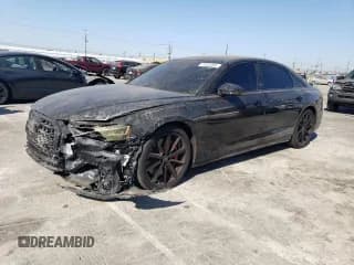 ✅ 2023 Audi S8 • VIN: WAULSAF84PN010972 • Лот: 71031464. Опубликован ранее на Copart с пробегом 11 312 миль. Бесплатный доступ к архиву аукционных продаж из США и подробный отчёт об истории автомобиля на DreamBid. Изображение 1.