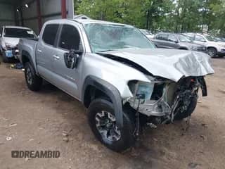 2022 Toyota Tacoma SR5 with VIN 3TMAZ5CN0NM185329, listed as a IAAI auction lot 42947261 with 67,707 mi miles and . Bid and sale history available at DreamBid. Image 1.