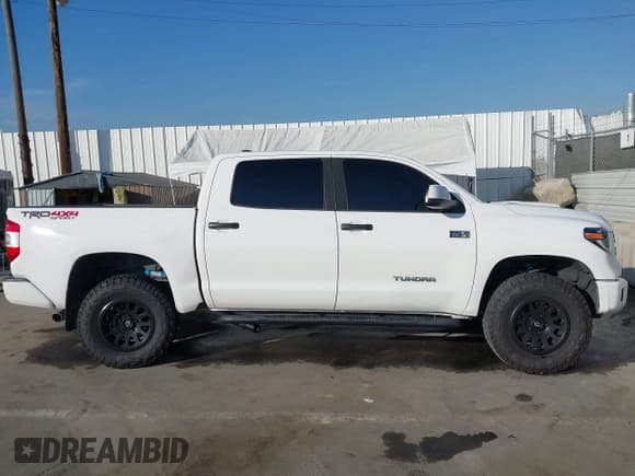 ✅ 2020 Toyota Tundra SR5 • VIN: 5TFDY5F13LX908381 • Lot: 43850031. Listed on IAAI with 102,573 mi. Free auction sales archive from the USA and detailed vehicle history report at DreamBid. Image 13.