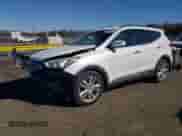 2014 Hyundai Santa Fe z VIN 5XYZUDLAXEG190334, wystawiony jako Copart lot #85566705 z przebiegiem 186 994 mil mil oraz Nie do naprawy • Non repairable. Historia ofert i sprzedaży dostępna na DreamBid. Obrazek 1.