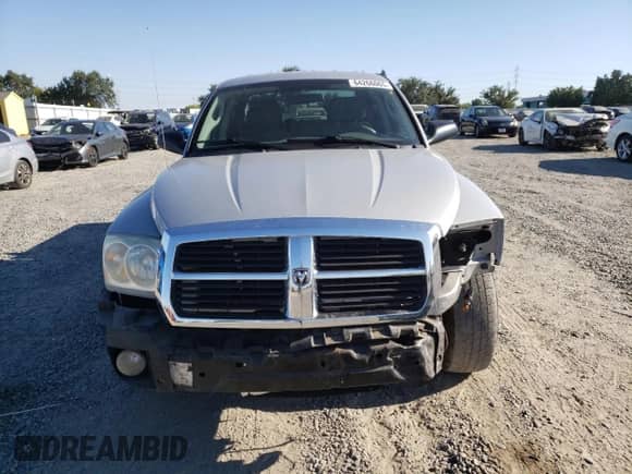 2005 Dodge Dakota SLT с VIN 1D7HE48N25S218888, выставлен на аукционе Copart как лот 64266065 с пробегом 167 867 миль миль и Списание • Salvage title. История ставок и продаж доступна на DreamBid. Изображение 5.
