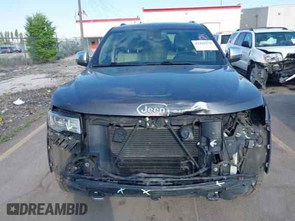 ✅ 2015 Jeep Grand Cherokee Overland • VIN: 1C4RJFCM7FC848289 • Lot: 42416578. Listed on IAAI with Not provided. Free auction sales archive from the USA and detailed vehicle history report at DreamBid. Image 13.