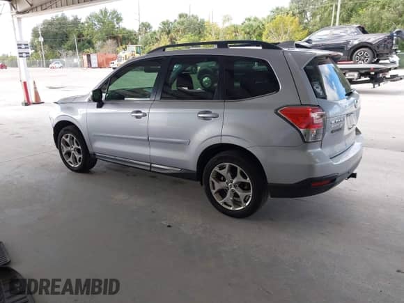 2017 Subaru Forester Touring z VIN JF2SJAWC7HH555670, wystawiony jako IAAI lot #43471642 z przebiegiem 89 476 mil mil oraz . Historia ofert i sprzedaży dostępna na DreamBid. Obrazek 3.