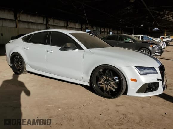 ✅ 2014 Audi RS 7 Prestige • VIN: WUAW2AFC8EN902596 • Лот: 79125134. Опубликован ранее на Copart с пробегом 80 122 миль. Бесплатный доступ к архиву аукционных продаж из США и подробный отчёт об истории автомобиля на DreamBid. Изображение 4.
