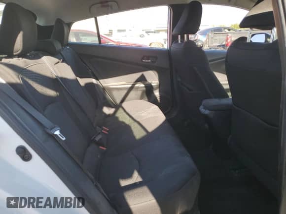 2021 Toyota Prius L Eco с VIN JTDKAMFU6M3142123, выставлен на аукционе Copart как лот 55076445 с пробегом 68 256 миль миль и Списание • Salvage title. История ставок и продаж доступна на DreamBid. Изображение 10.