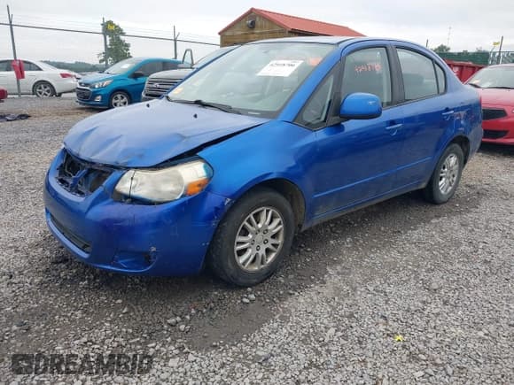 ✅ 2013 Suzuki SX4 LE • VIN: JS2YC5A32D6100013 • Lot: 42918706. Wystawiony na IAAI z przebiegiem 184 918 mil. Bezpłatny archiwum sprzedaży aukcyjnych z USA i szczegółowy raport historii pojazdu na DreamBid. Zdjęcie 2.