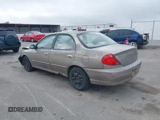 ✅ 2003 Kia Spectra • VIN: KNAFB121135263215 • Лот: 42448038. Опубликован ранее на IAAI с пробегом 132 979 миль. Бесплатный доступ к архиву аукционных продаж из США и подробный отчёт об истории автомобиля на DreamBid. Изображение 3.